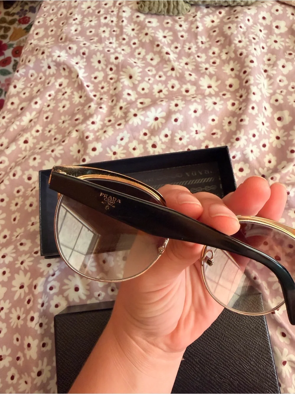 Prada Women’s Black Sunglasses with Gold Trim